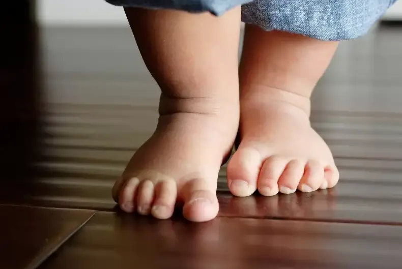 Why Do Toddlers Put Their Feet on You? PostureInfoHub
